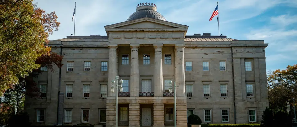 The North Carolina State Capitol in Raleigh under a blue sky